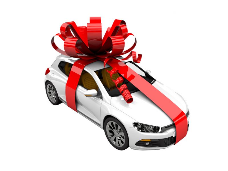 a picture of a car in a huge gift wrap bow