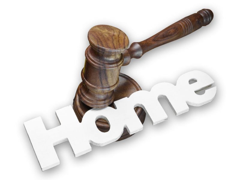 a picture of a gavel on top of the word home