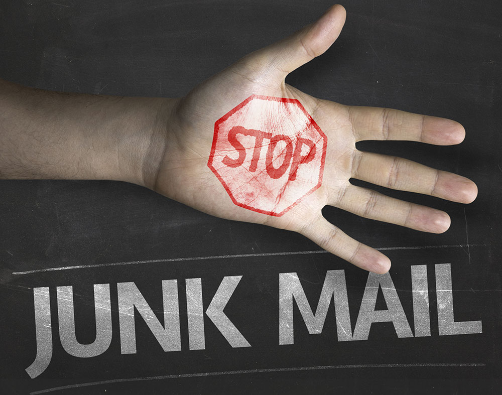 a hand indicating to stop junk e-mails