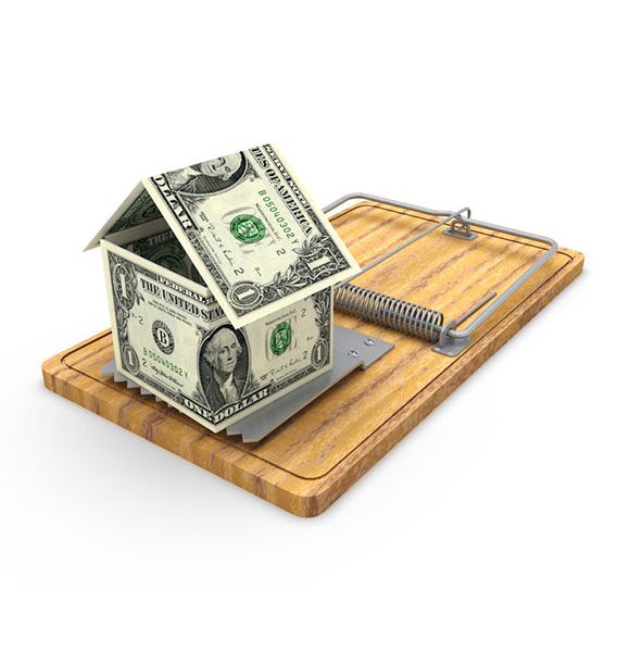 a picture of a dollar in a form of a house on top of a mouse trap as bait