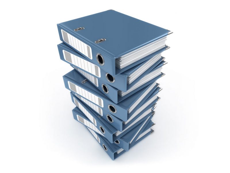 a stack of binders with court papers