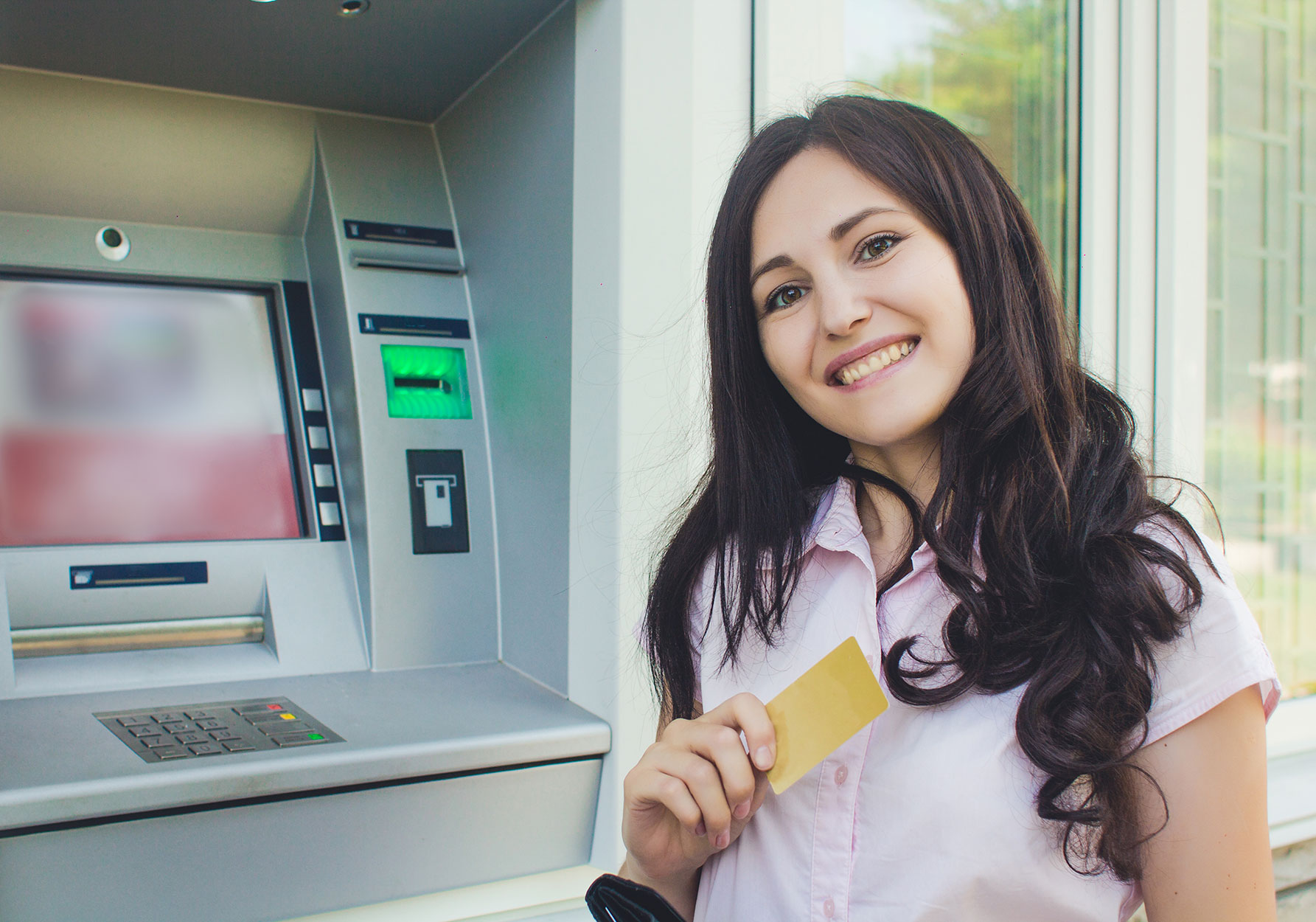 lady going through the bank atm