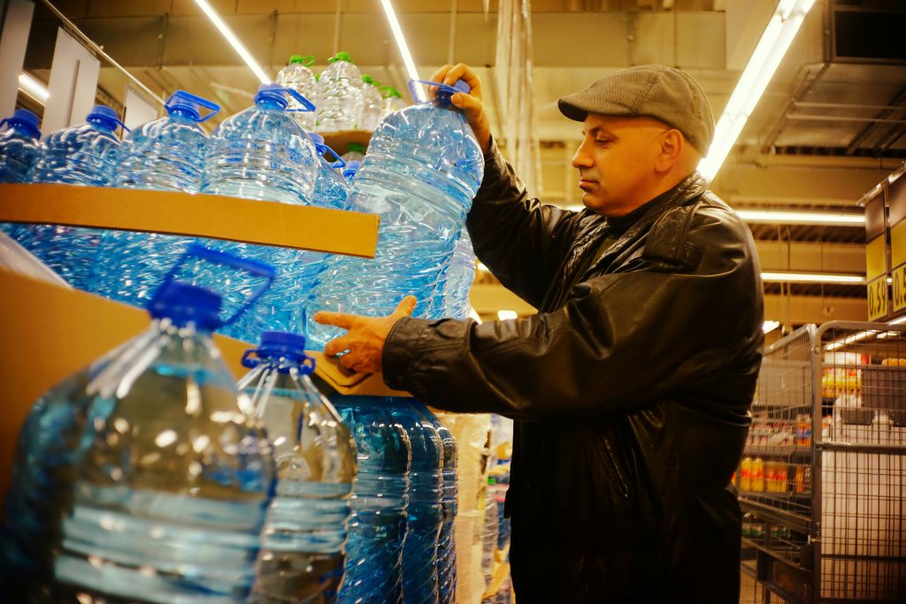 Man stocks up on water bottles