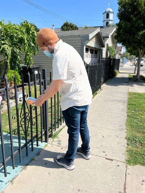 A DCBA associate canvasses a neighborhood to give information about tax preparation services and available tax credits.